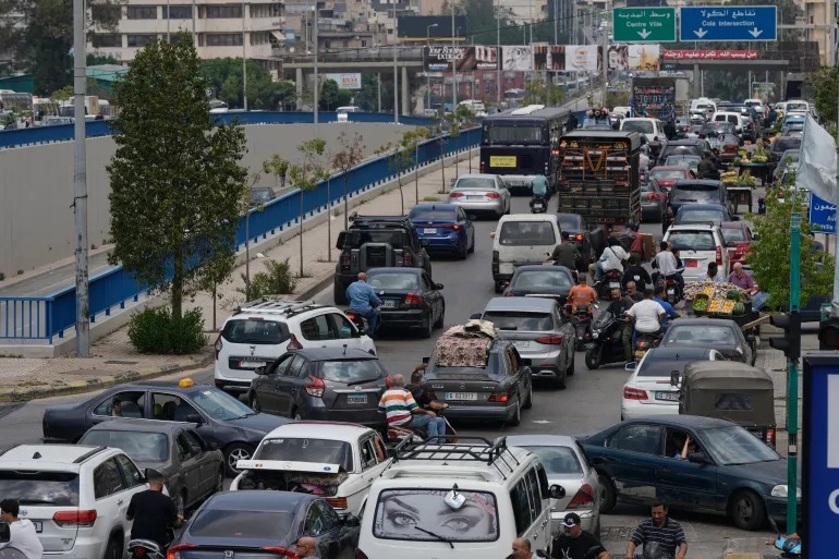 Lebanese start fleeing south Beirut after Israel says will target the area
